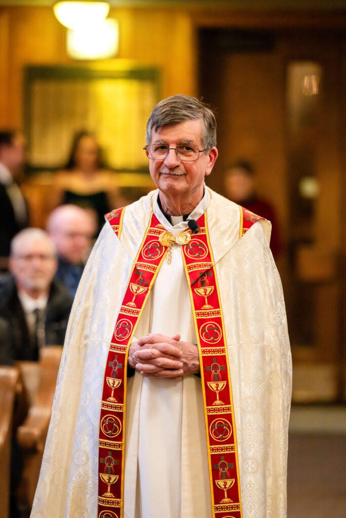 Catholic priest officiating Jeff and Isabel’s winter wedding ceremony in Chicago